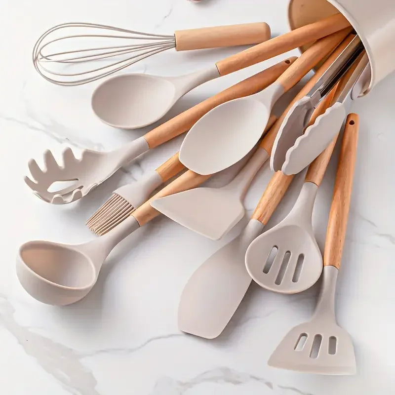 Set of kitchen utensils with wooden handles on a marble surface. silicone wooden handle kitchen utensil set Pakistan.