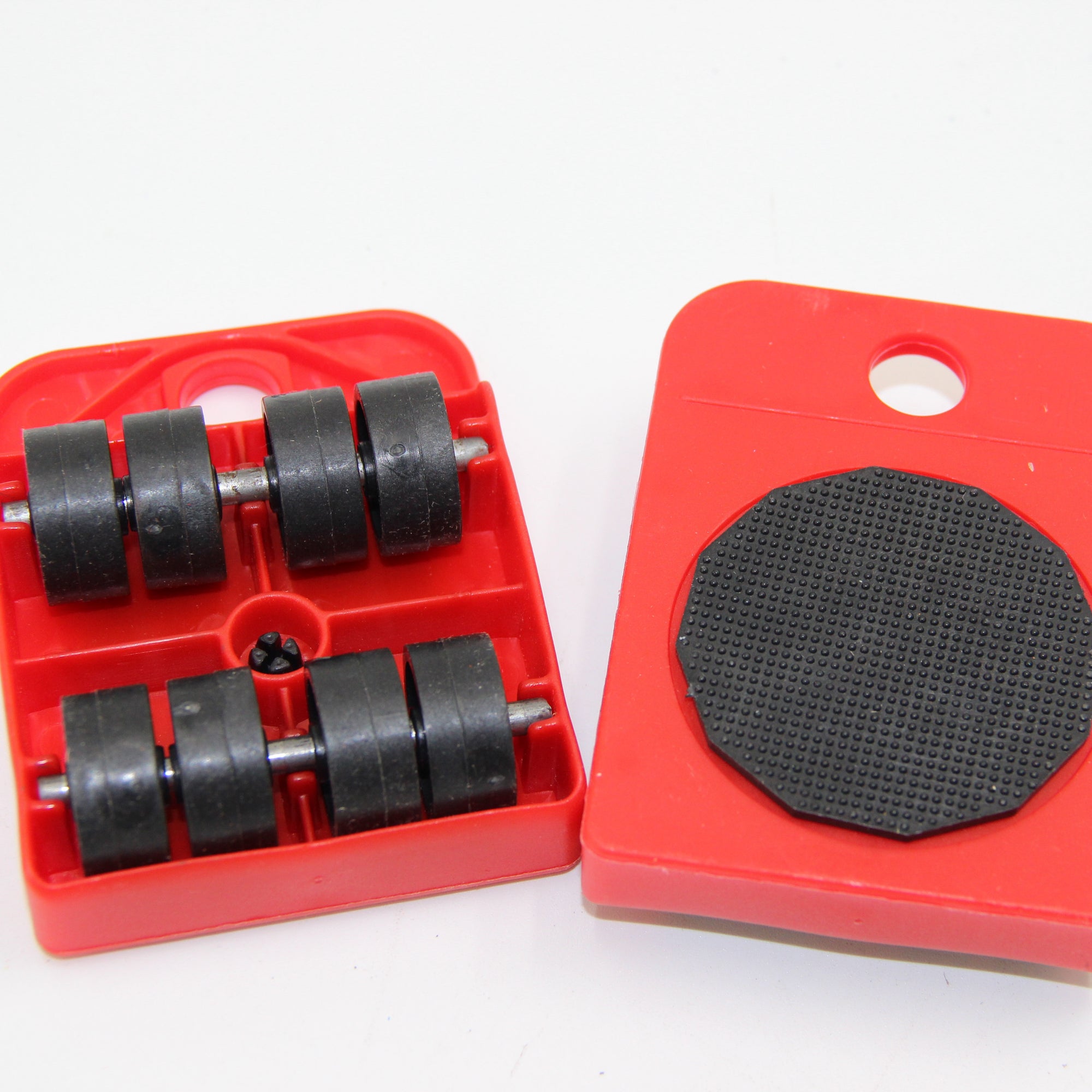 Red tool kit with black rollers and a black pad on a white background. furniture lifter 150kg, heavy appliance slider, move fridge alone, DIY sofa moving rollers, 5pcs furniture moving kit.