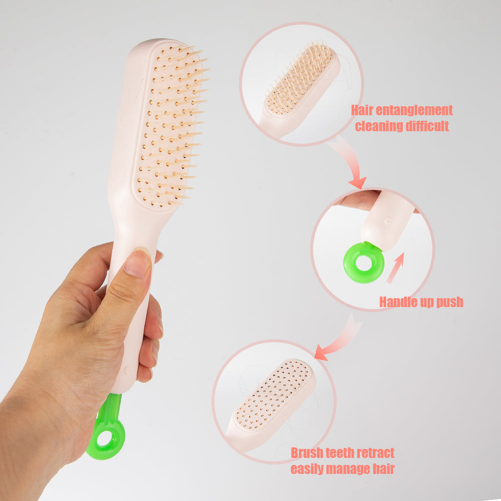 Hand holding a hairbrush with features highlighted on a white background. retractable bristle hairbrush, easy clean massage comb, anti static hair brush Pakistan, one click cleaning hair brush