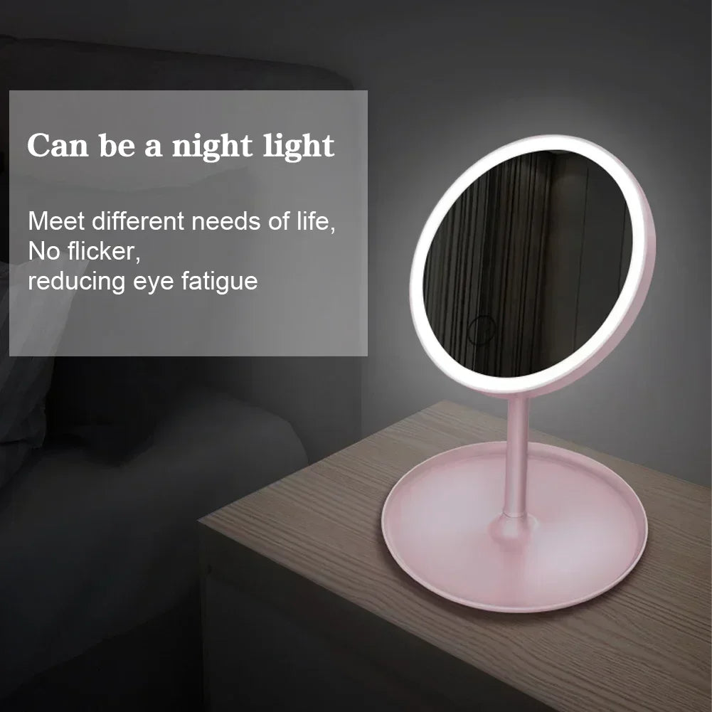 Pink vanity mirror with LED lighting on a dark surface, text overlay about night light functionality.