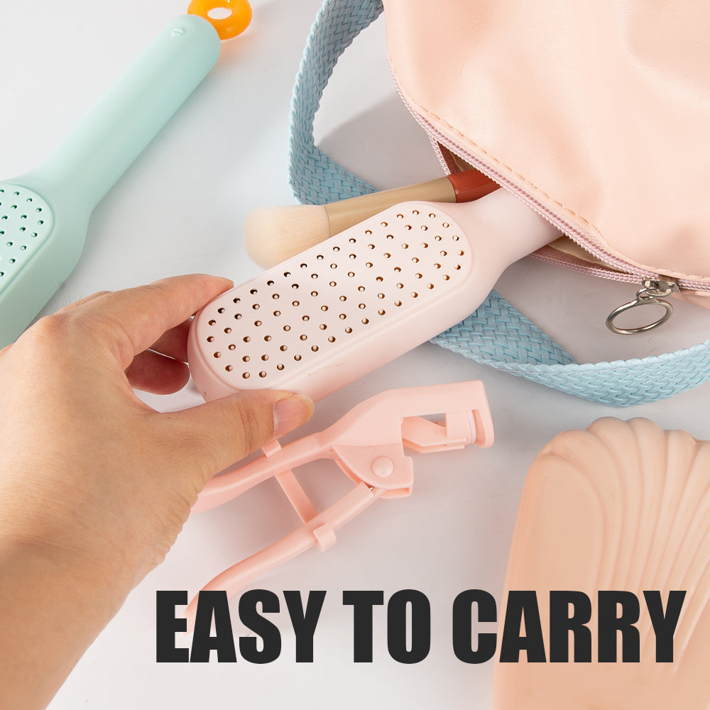 Hand holding a self cleaning hair brush with text 'EASY TO CARRY' on a light background.