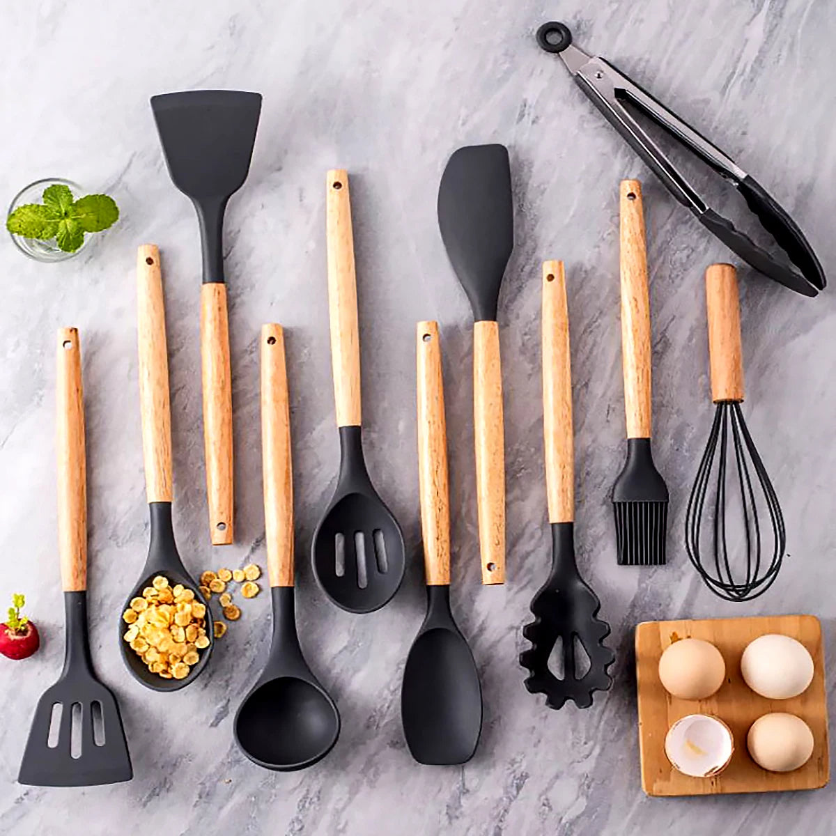 Set of kitchen utensils with wooden handles on a marble surface. silicone wooden handle kitchen utensil set Pakistan.