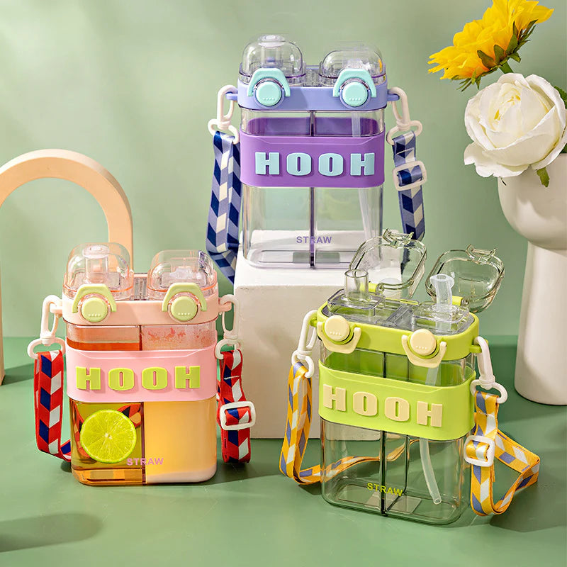 Colorful water bottles with 'HOOH' branding on a green surface with flowers in the background. HOOH water pot 800ml, double chamber bottle with strap, kids crossbody water bottle, two drinks bottle, HOOH split drink bottle, dual chamber water bottle, 2‑in‑1 water bottle Pakistan.