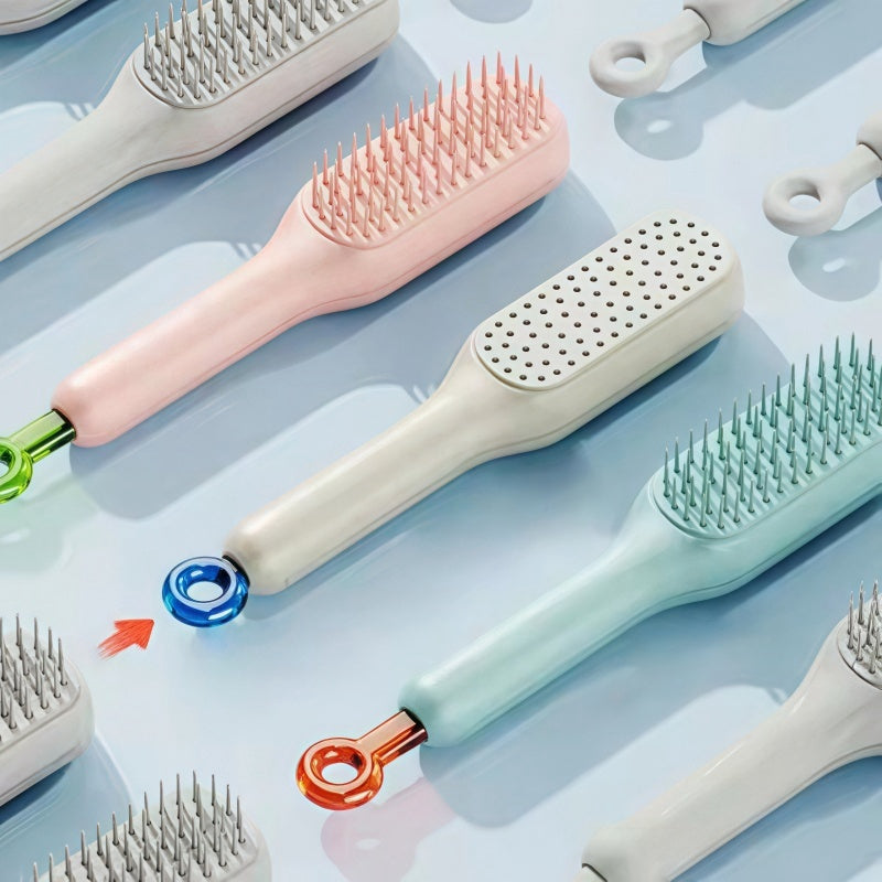 Collection of various self cleaning hair brush on a light blue background