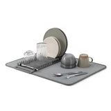 Dish drying rack with plates, bowls, and cups on a white background