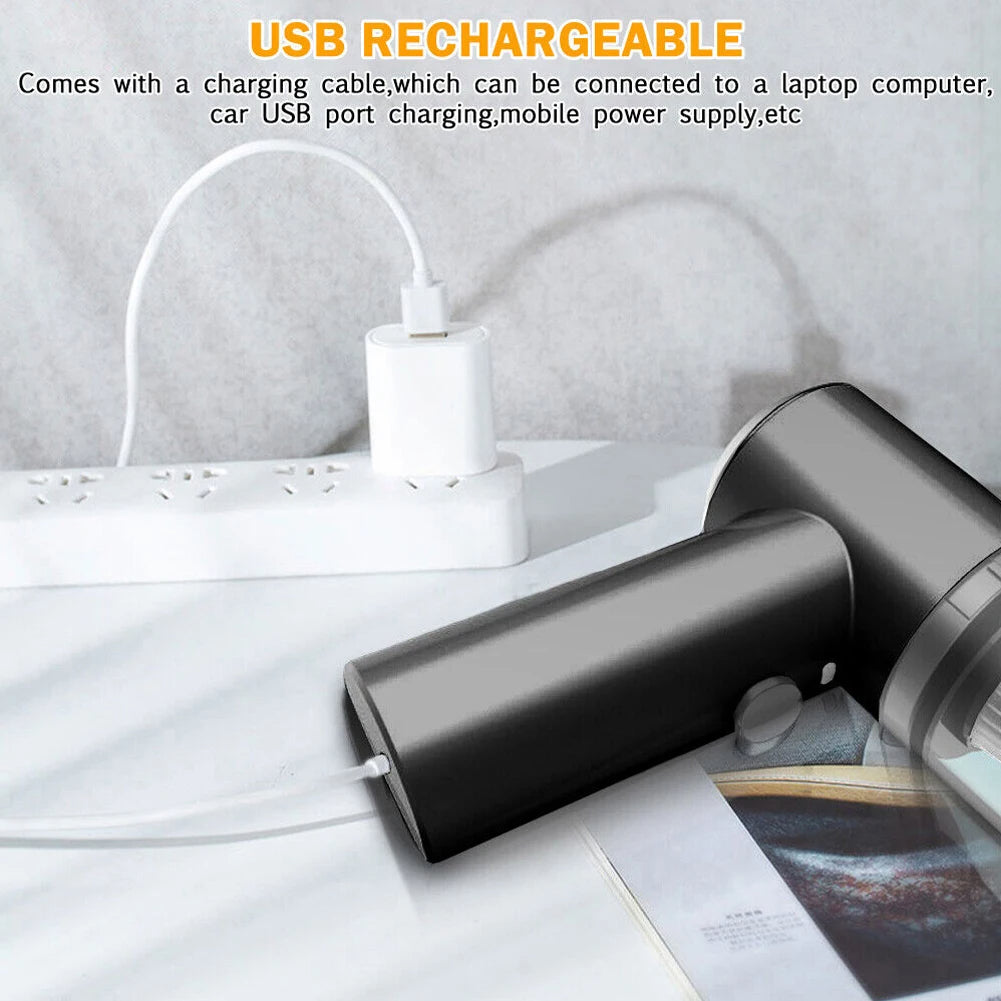 Black hair dryer with USB rechargeable feature on a white surface. 9000Pa mini vacuum price, USB-C handheld vacuum LED, 3-in-1 blower duster vacuum, portable wet dry vacuum Pakistan