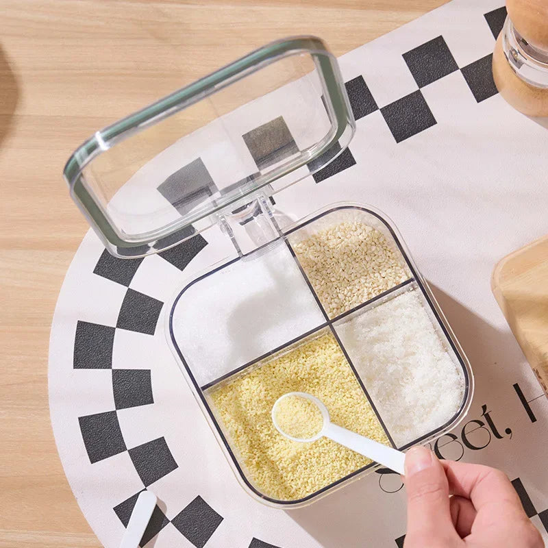 Container with compartments filled with different types of spices on a checkered tablecloth.