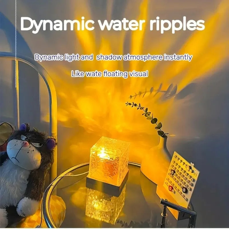 Decorative lamp with dynamic water ripple effect on a table with a toy and plant.