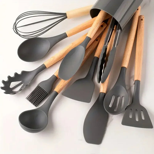 Set of kitchen utensils with gray silicone heads and wooden handles on a white background. silicone wooden handle kitchen utensil set Pakistan.