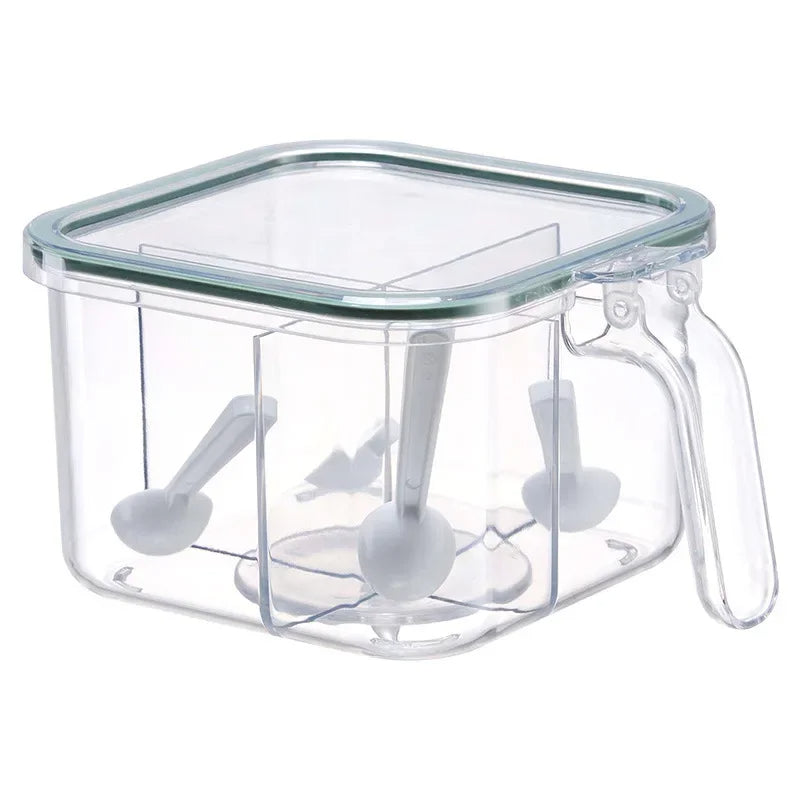 Clear plastic container with white tools inside on a white background. 4 partition spice box Pakistan